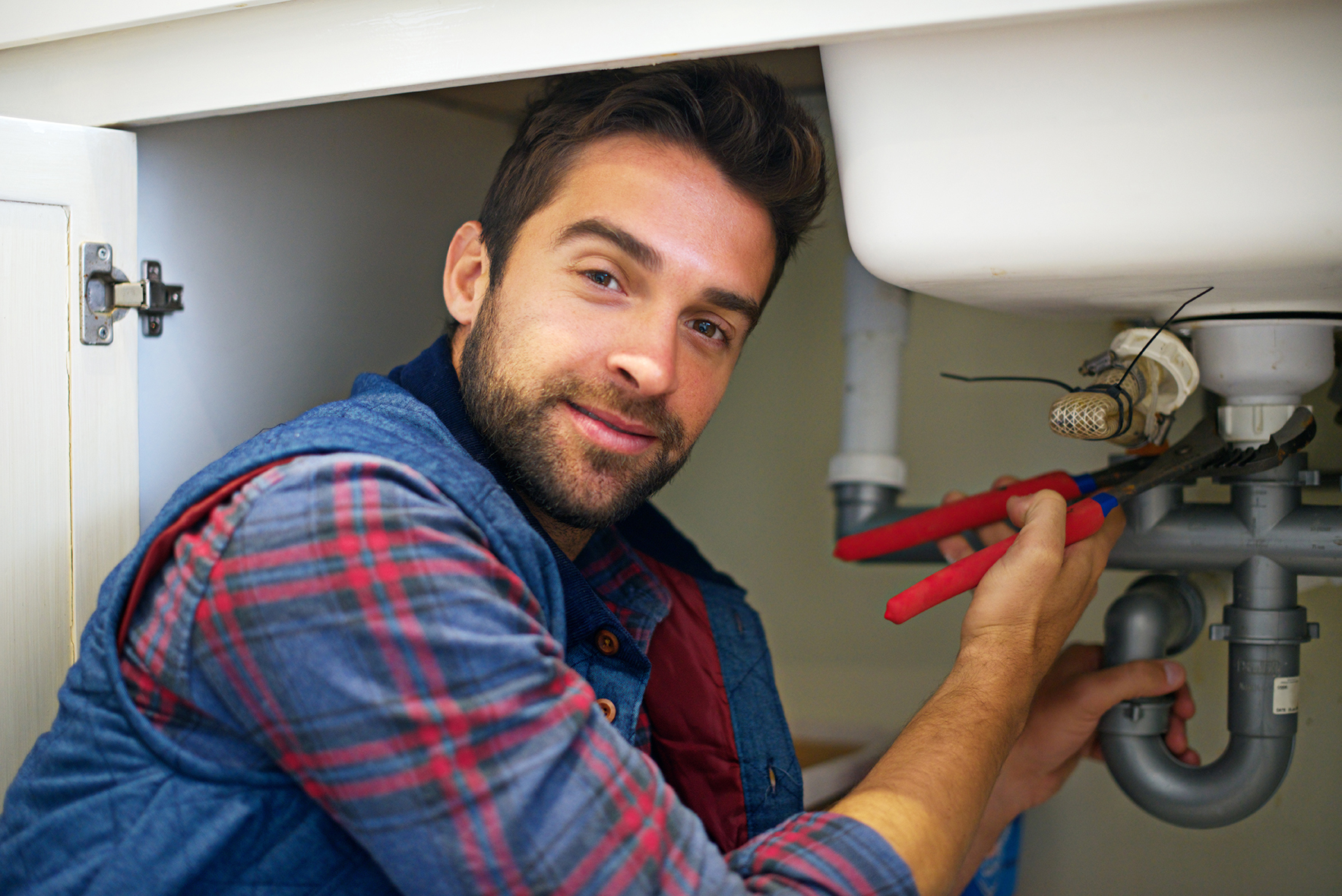 Plumber under sink